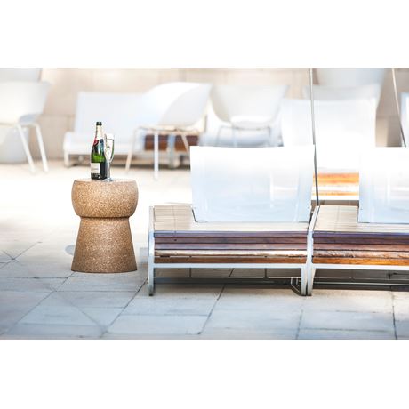 giant cork table outside by two sun loungers